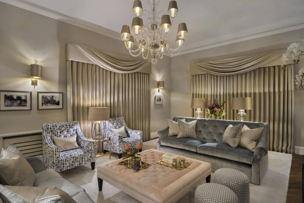 Stunning and classical living room design with velvet and silk fabric and luxurious swag style curtains
