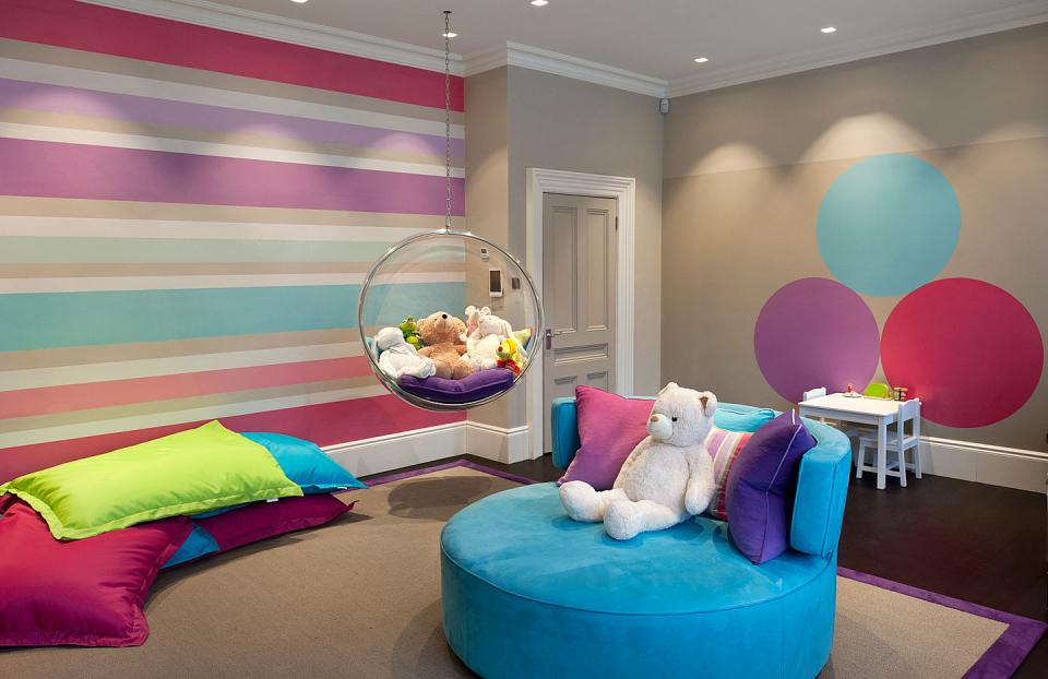 Fun and colourful childrens playroom with wall art