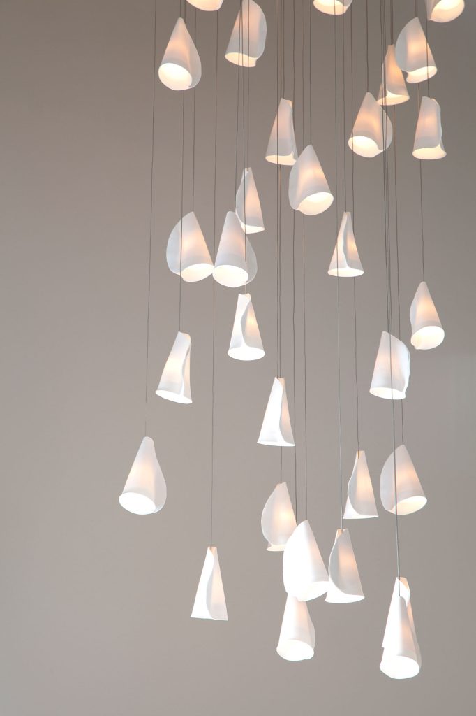 Stunning cascading lighting with porcelain curled white shells